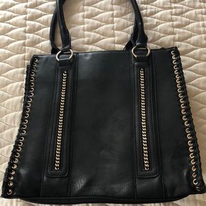 Black leather shoulder purse with gold detailing.